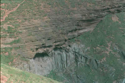 Photograph showing horizontal beds of Old Red Sandstone overly vertical beds of Silurian grewackes