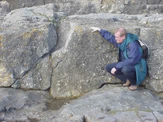 Photo: Paul Garner examining the Sutton Stone